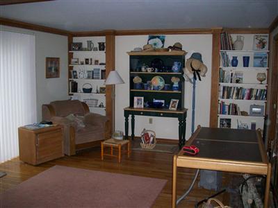 9 Spoondrift Circle Mashpee, MA 02649 - Photo 9 of 21 a living room with furniture and a book shelf
