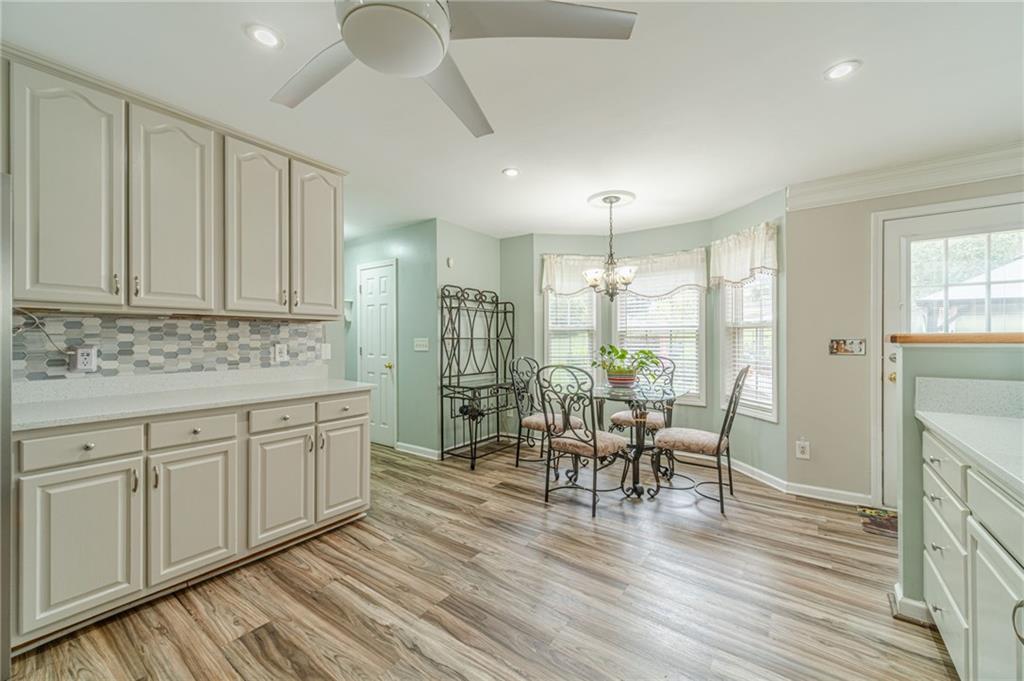 3442 Flat Run Drive Southeast Bethlehem, GA 30620 - Photo 11 of 47 a view of a dining room with furniture window and wooden floor