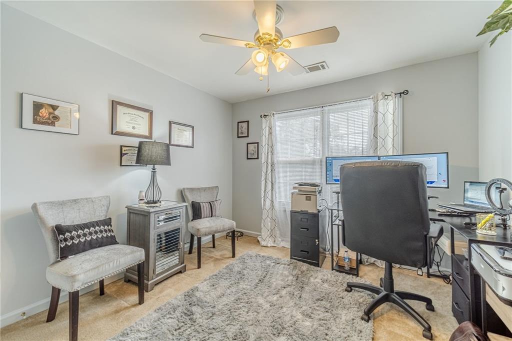 3442 Flat Run Drive Southeast Bethlehem, GA 30620 - Photo 21 of 47 a view of a workspace with furniture and a window
