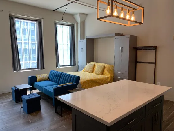 a bedroom with two beds and a window