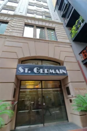 a street view with tall buildings and a street light