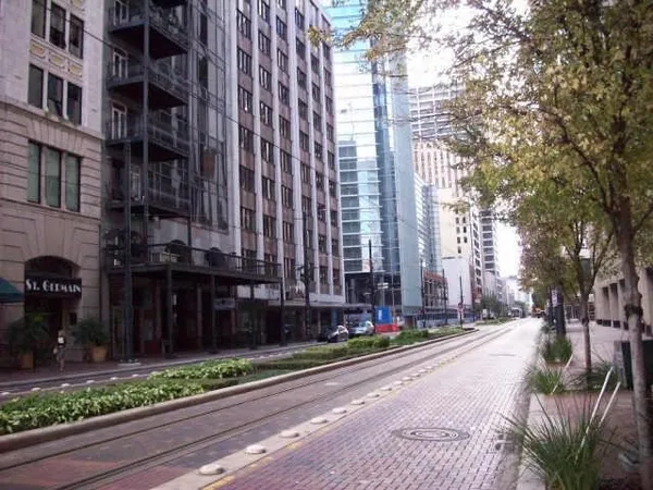 a room with a table chairs and wooden floor