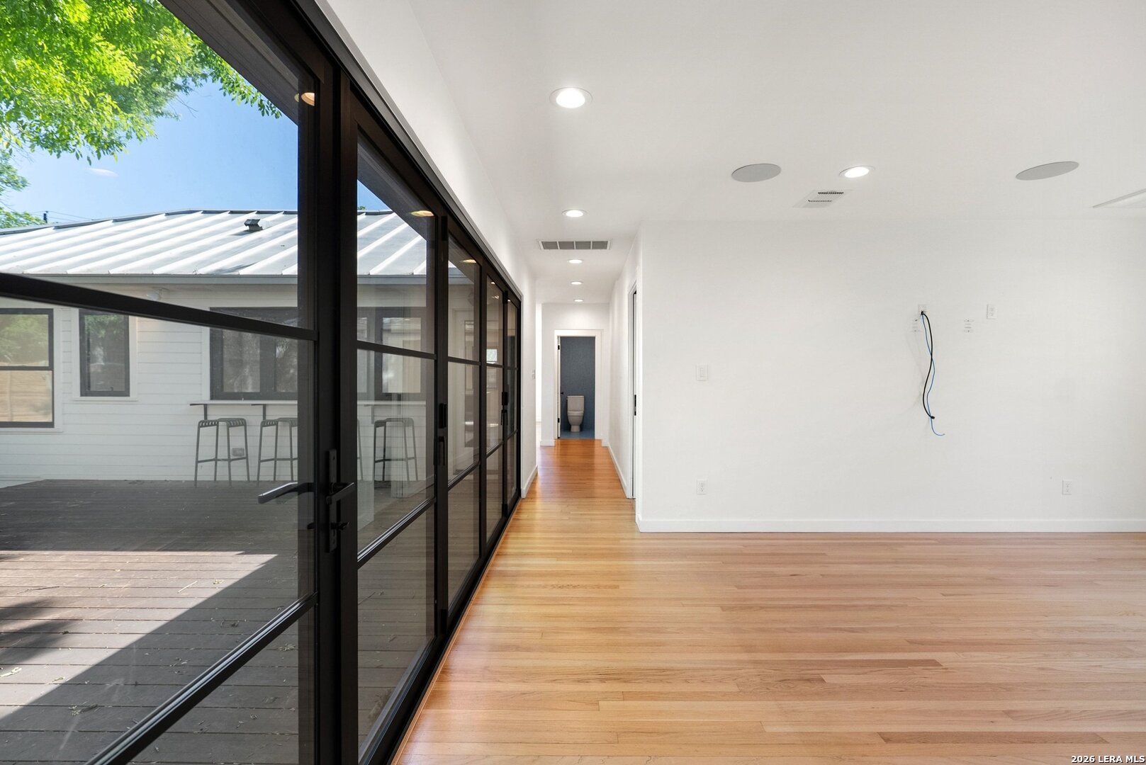 1402 Hutto Road Georgetown, TX 78626 - Photo 16 of 34 a view of a hallway with wooden floor and staircase