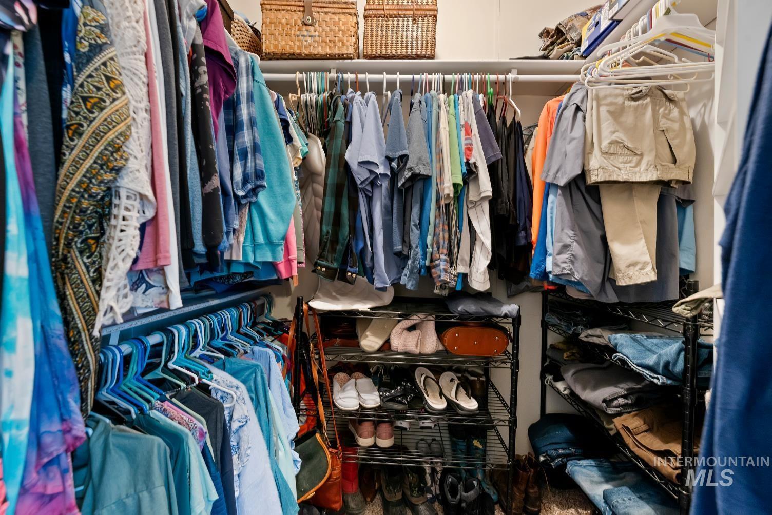19152 Marsing Road Caldwell, ID 83607 - Photo 29 of 47 Walk-in closet featuring multiple hanging rods, overhead shelving, and integrated wire shelving units for organization