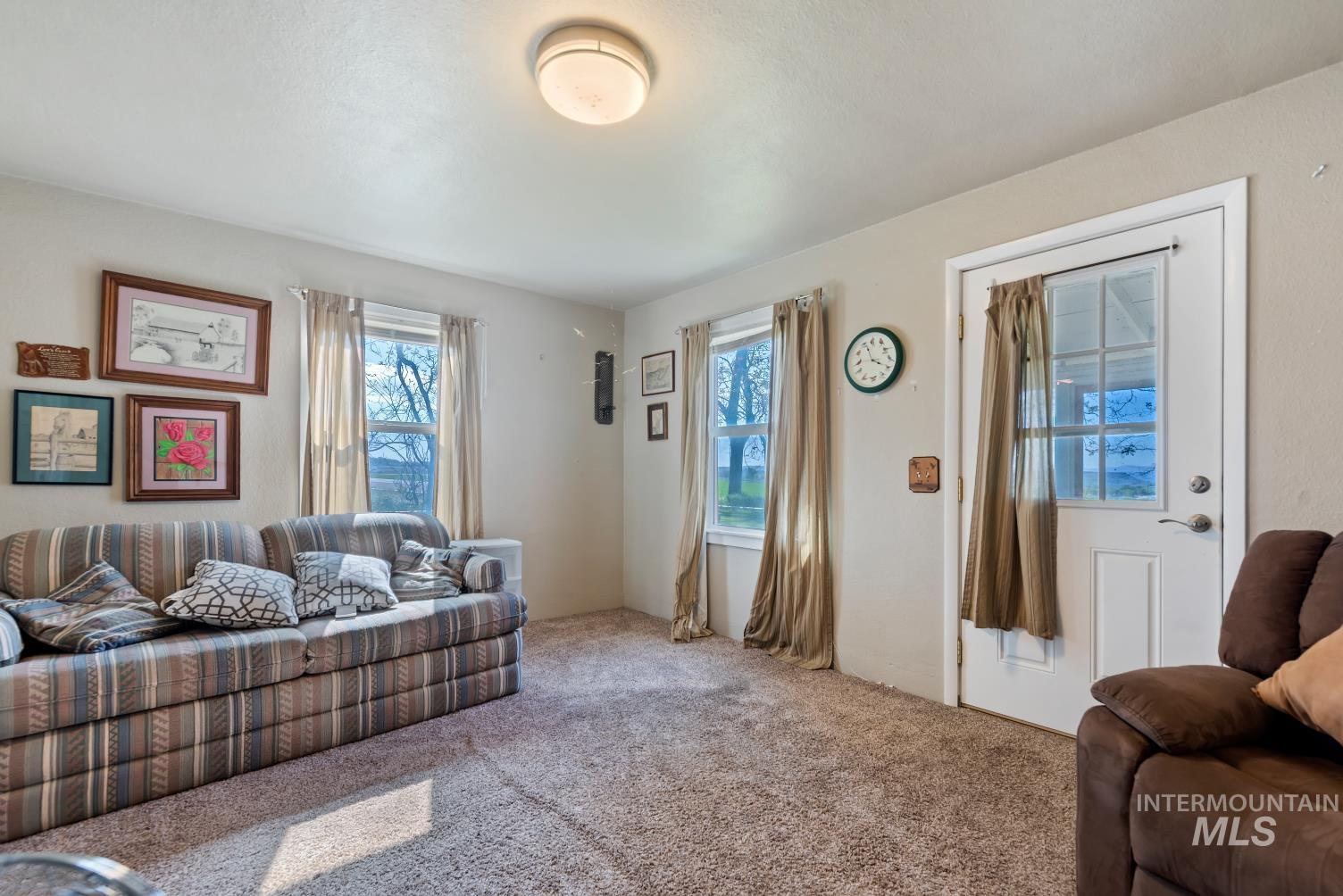 19152 Marsing Road Caldwell, ID 83607 - Photo 42 of 47 Carpeted living space with neutral wall tones