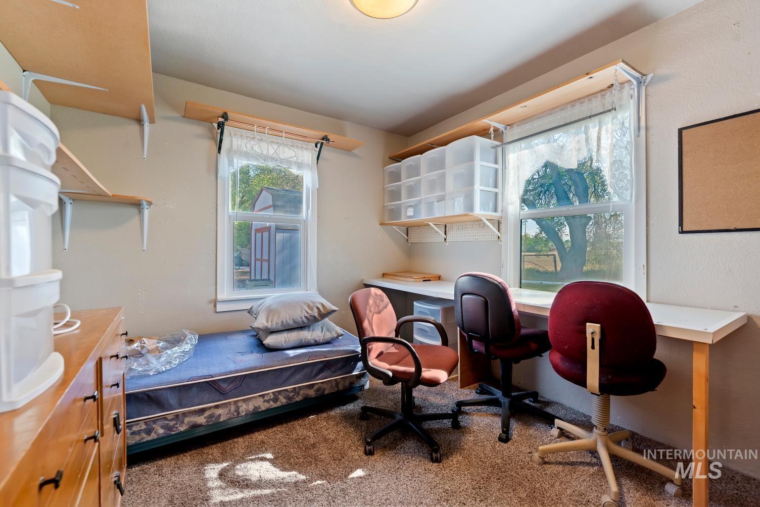 19152 Marsing Road Caldwell, ID 83607 - Photo 44 of 47 Carpeted room with multiple windows providing natural light
