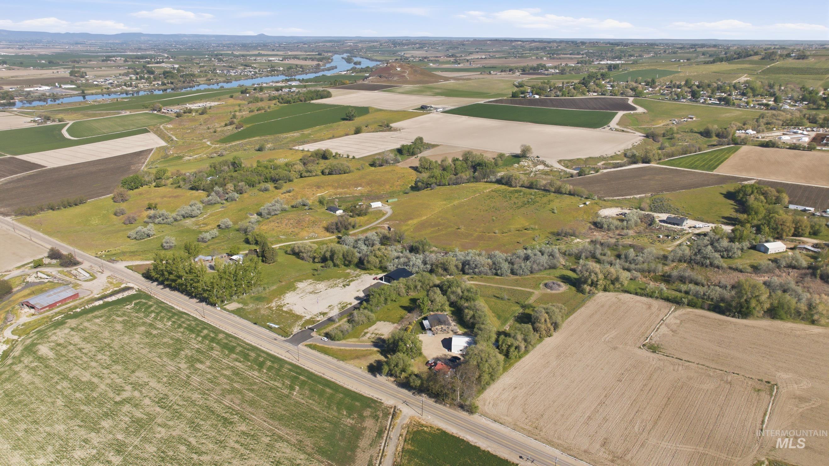 19152 Marsing Road Caldwell, ID 83607 - Photo 46 of 50 Aerial perspective showcasing varied terrain, including agricultural fields, natural waterways, and undeveloped land