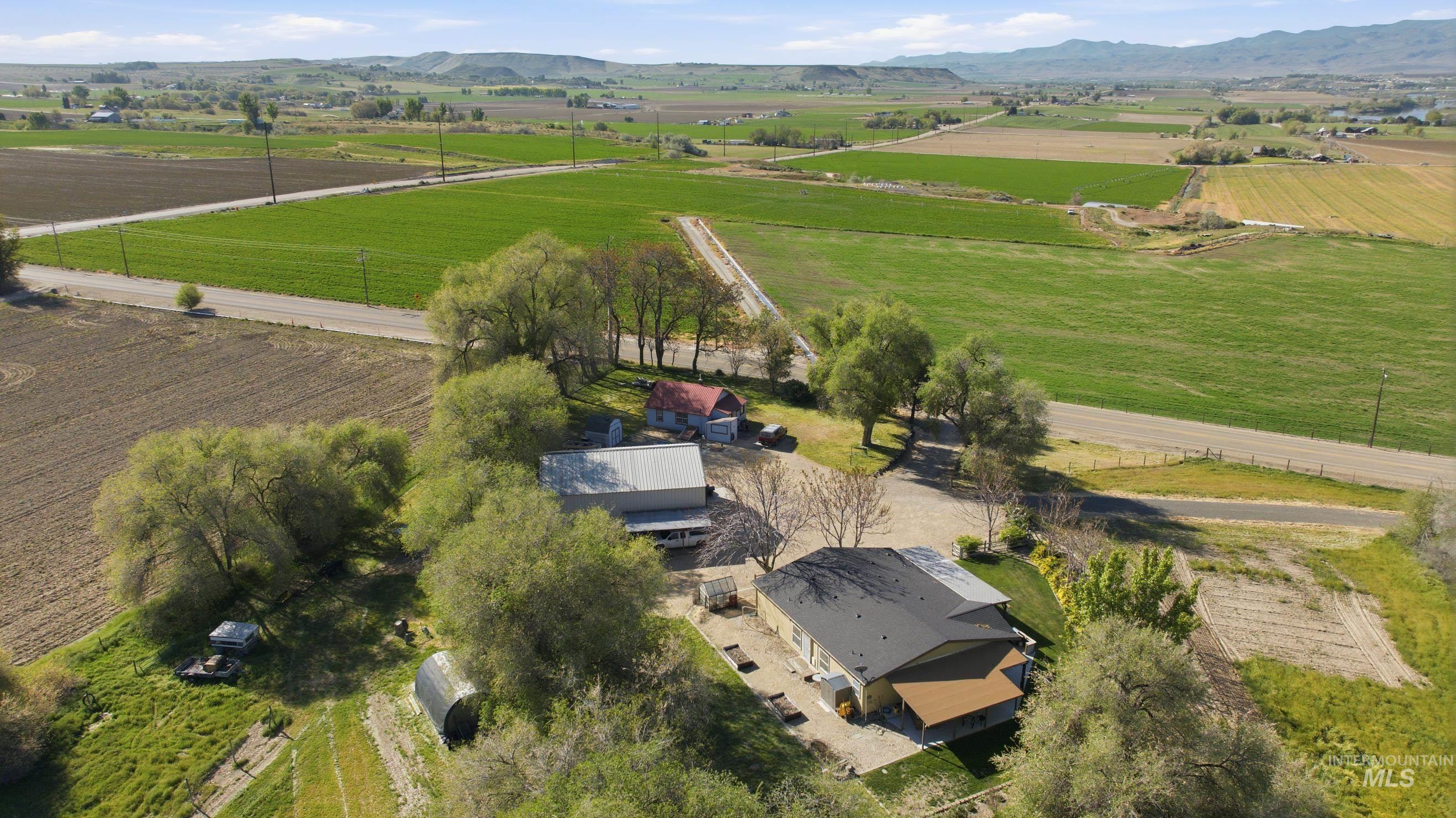19152 Marsing Road Caldwell, ID 83607 - Photo 48 of 50 Aerial perspective showcasing the property's expansive agricultural surroundings