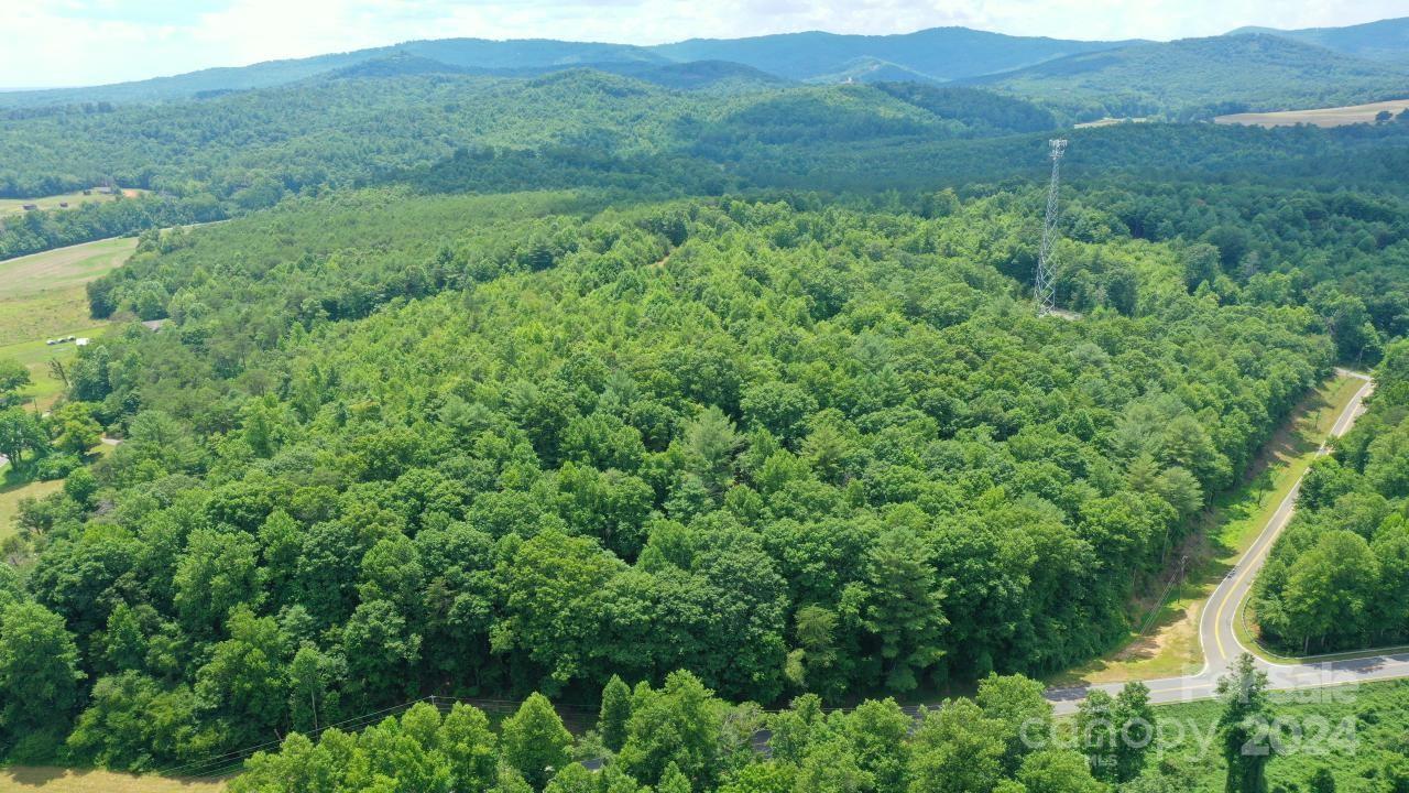 0 Hunt Road Bostic, NC 28018 - Photo 11 of 14 a view of a lush green hillside and a houses