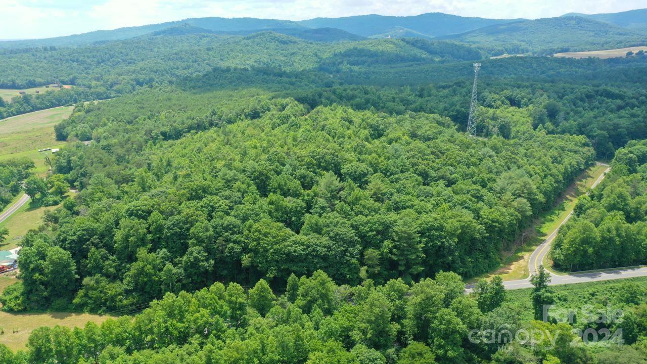 0 Hunt Road Bostic, NC 28018 - Photo 12 of 14 a view of a lush green hillside and a houses