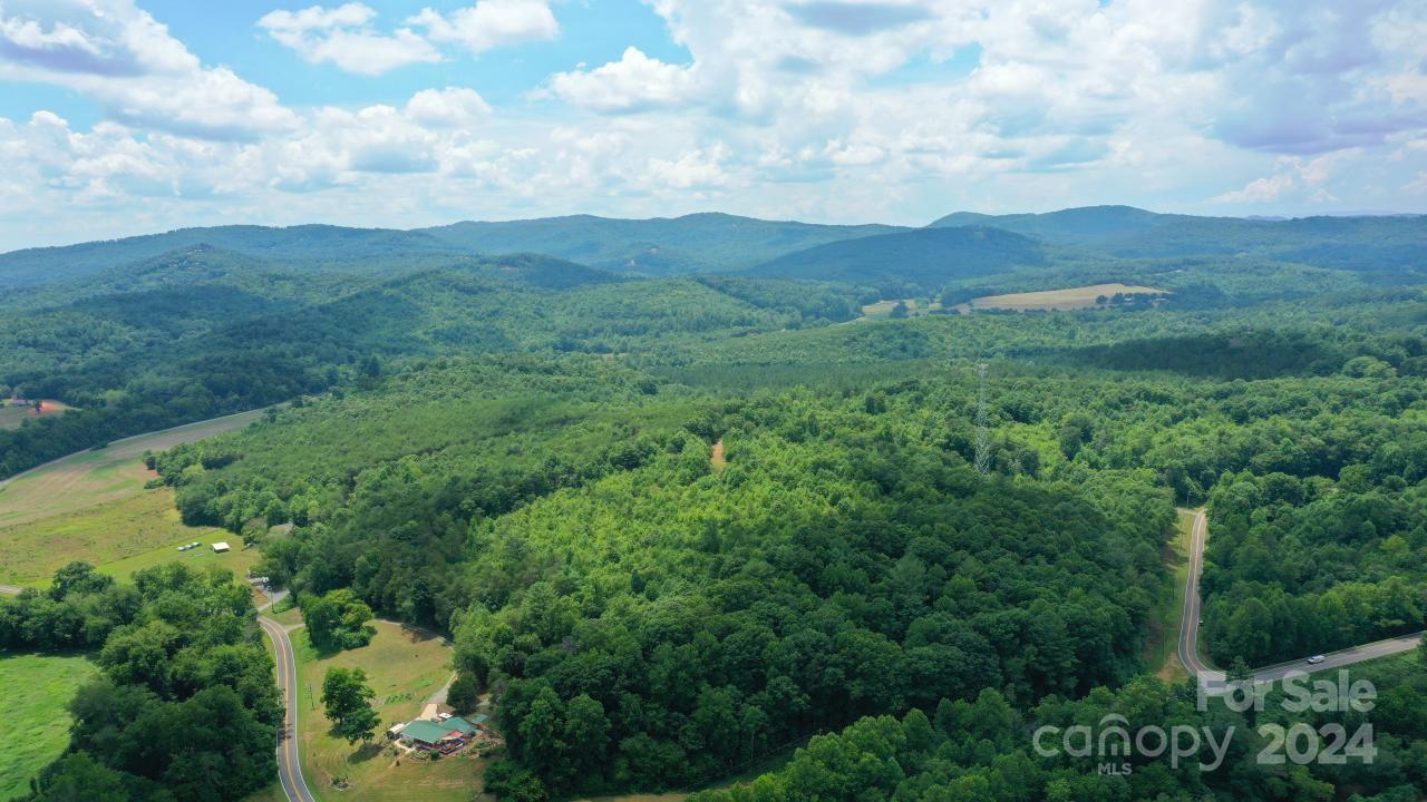 0 Hunt Road Bostic, NC 28018 - Photo 4 of 14 an aerial view of houses covered in trees