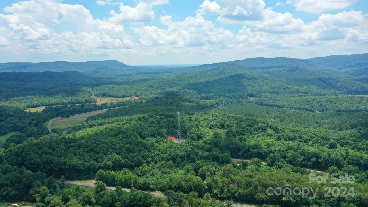 0 Hunt Road Bostic, NC 28018 - Photo 6 of 14 an aerial view of houses covered in trees