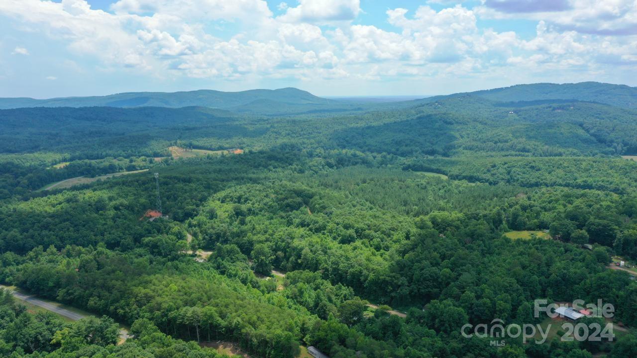 0 Hunt Road Bostic, NC 28018 - Photo 7 of 14 an aerial view of houses covered in trees