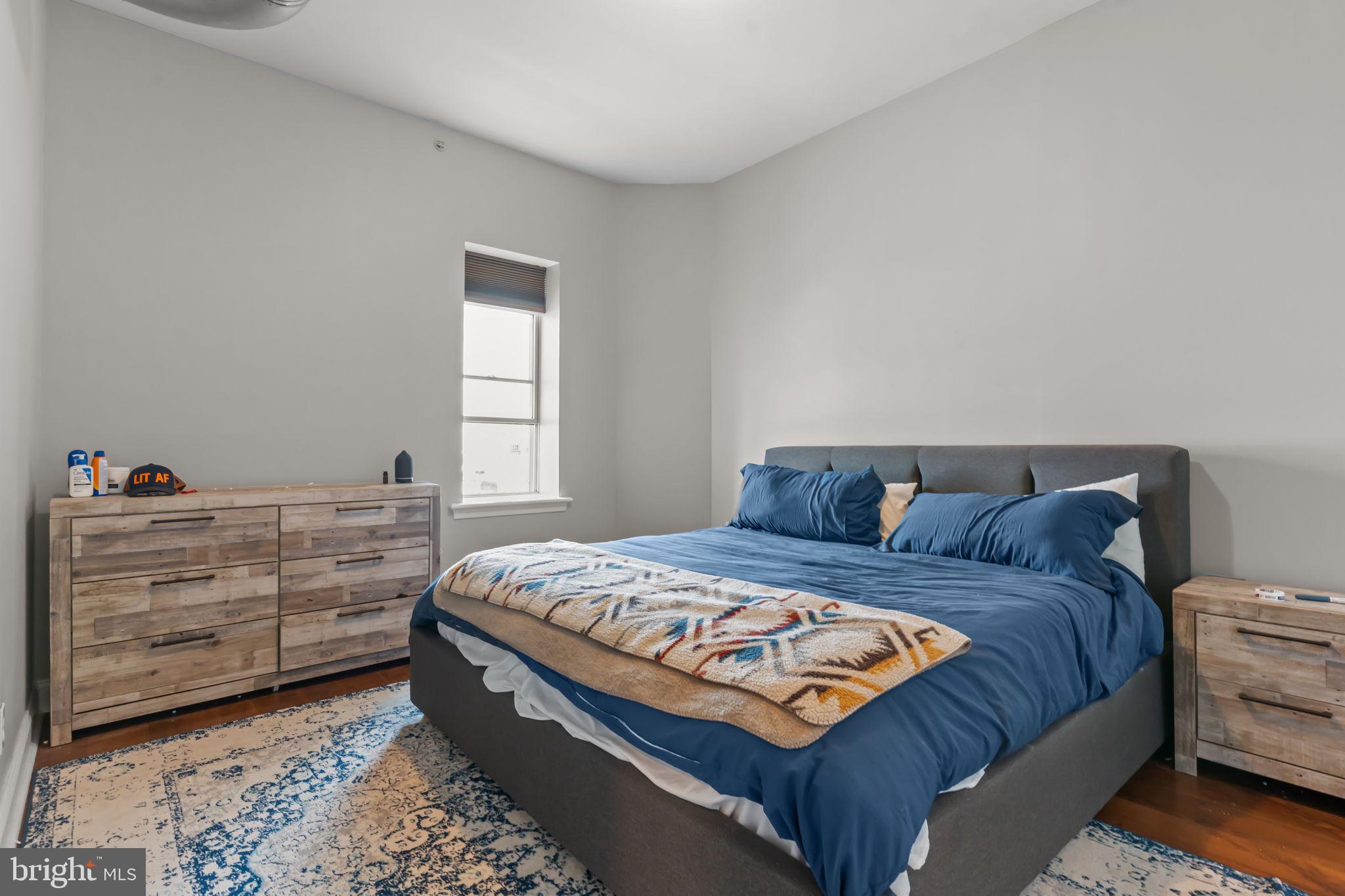 1801 East Passyunk Avenue, Unit B Philadelphia, PA 19148 - Photo 9 of 16 a bedroom with a bed and a window