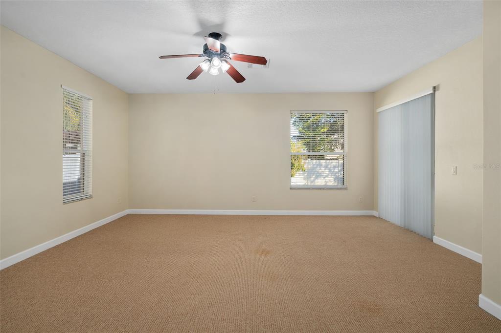 857 Timber Isle Drive Orlando, FL 32828 - Photo 13 of 54 a view of an empty room with a window