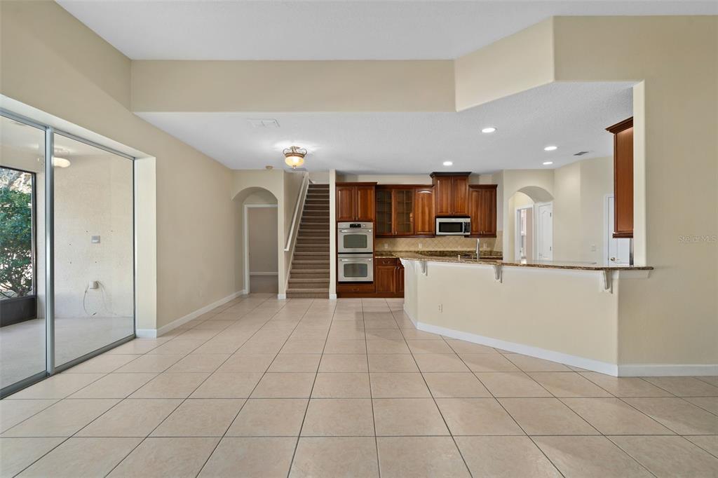 857 Timber Isle Drive Orlando, FL 32828 - Photo 17 of 54 a view of a kitchen with a sink and an empty room