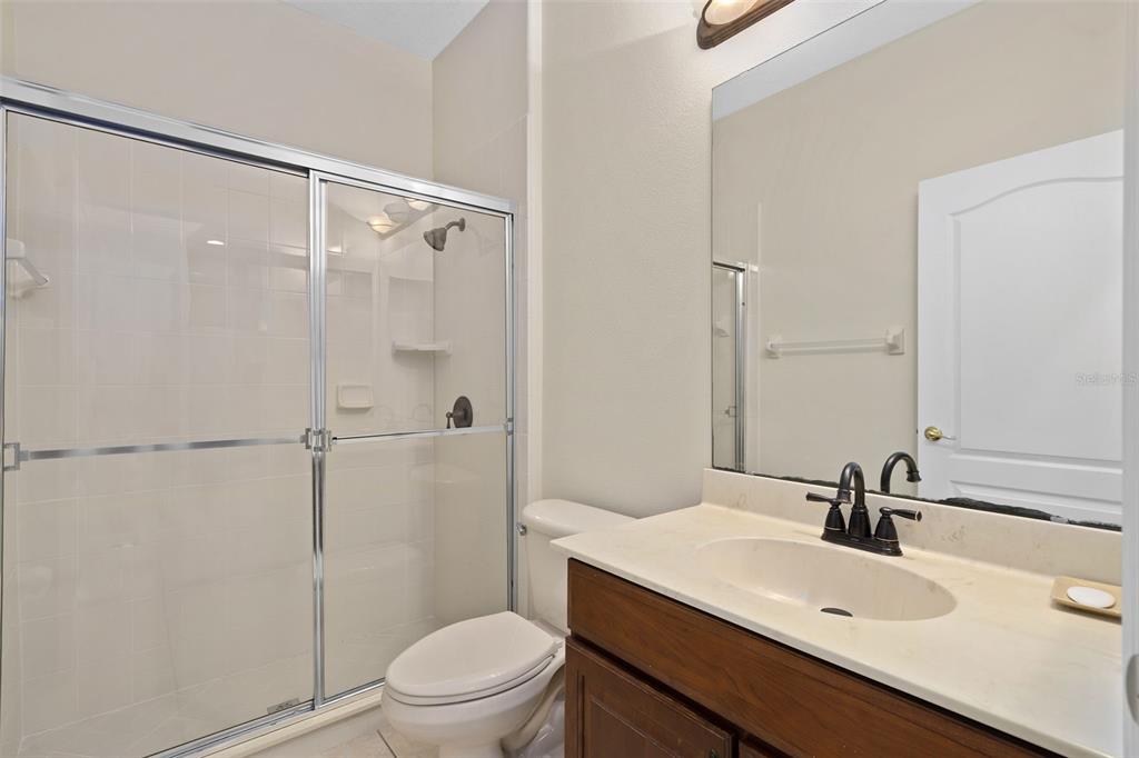 857 Timber Isle Drive Orlando, FL 32828 - Photo 27 of 54 a bathroom with a sink a toilet and shower