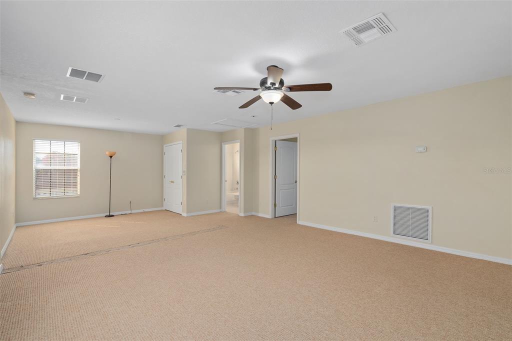 857 Timber Isle Drive Orlando, FL 32828 - Photo 32 of 54 a view of an empty room with a window