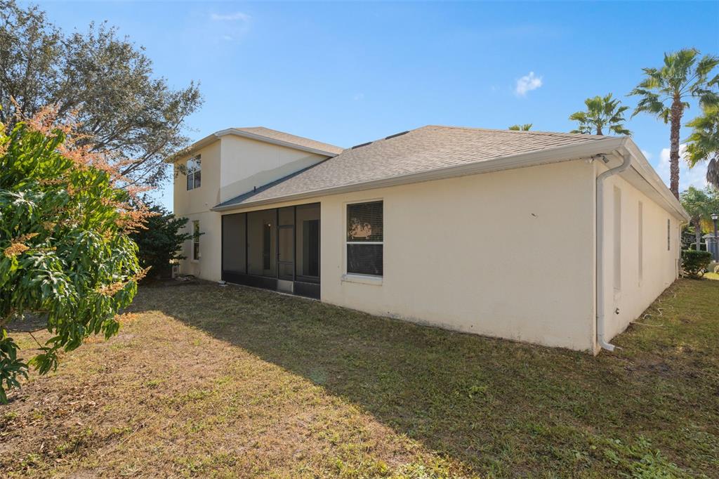 857 Timber Isle Drive Orlando, FL 32828 - Photo 38 of 54 a view of a house with a yard and potted plants