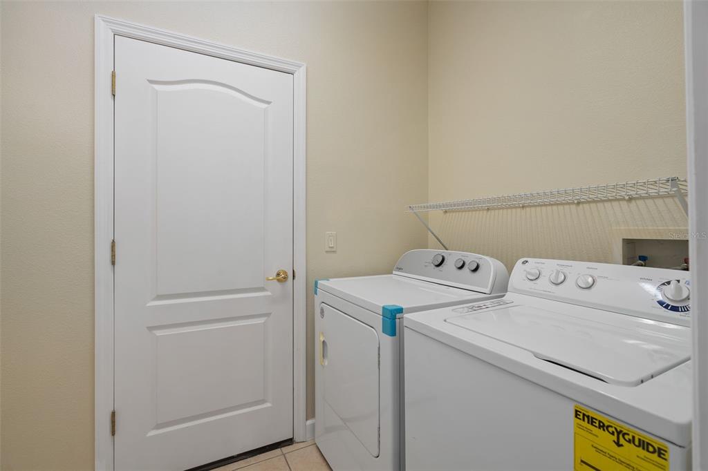 857 Timber Isle Drive Orlando, FL 32828 - Photo 40 of 54 a utility room with dryer and washer