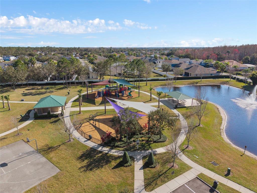 857 Timber Isle Drive Orlando, FL 32828 - Photo 42 of 54 a view of a swimming pool with a table and chairs