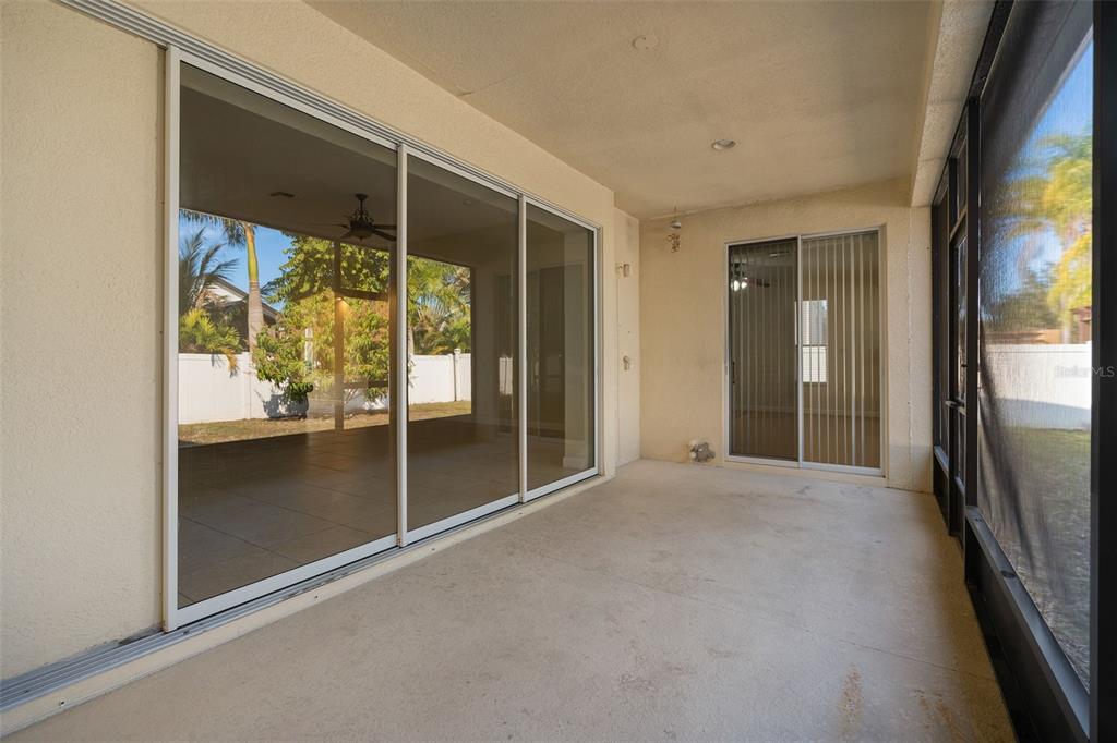 857 Timber Isle Drive Orlando, FL 32828 - Photo 43 of 54 a view of a hallway with wooden floor and a kitchen