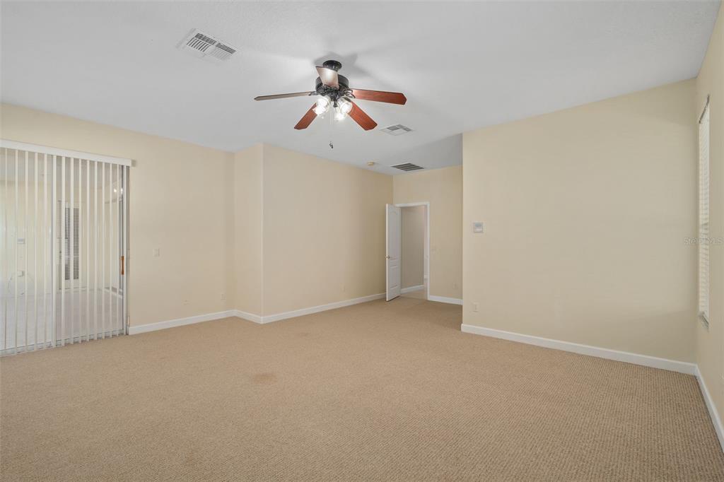 857 Timber Isle Drive Orlando, FL 32828 - Photo 10 of 54 an empty room with windows and fan