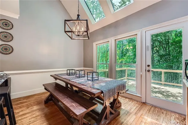 a view of a dining room with furniture window and outside view