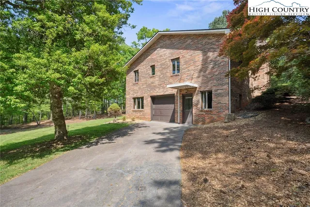 a view of yard with large tree