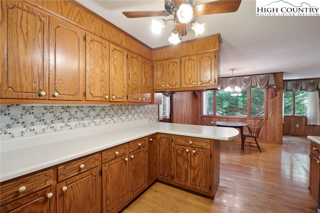 2076 Jay Clark Road Morganton, NC 28655 - Photo 22 of 36 a kitchen with stainless steel appliances granite countertop wooden cabinets a sink and dishwasher