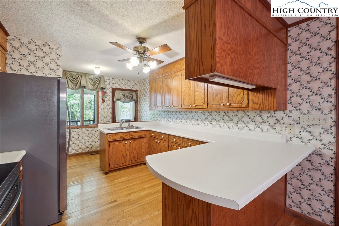 2076 Jay Clark Road Morganton, NC 28655 - Photo 23 of 36 a kitchen with granite countertop a sink a counter top space and cabinets