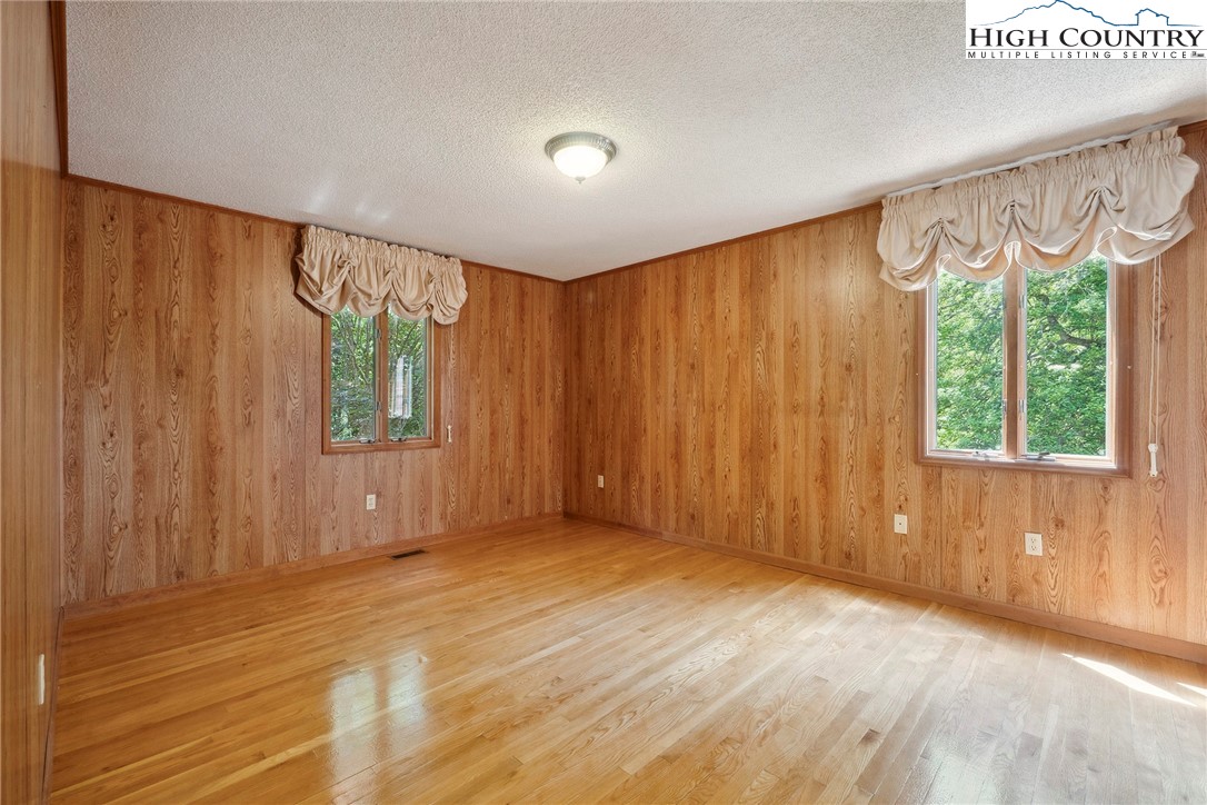 2076 Jay Clark Road Morganton, NC 28655 - Photo 26 of 36 a view of an empty room with a window and a bathroom