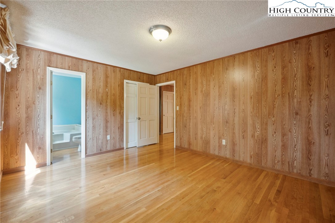 2076 Jay Clark Road Morganton, NC 28655 - Photo 27 of 36 a view of a room with wooden floor and windows