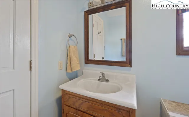 a view of walk in closet with white walls