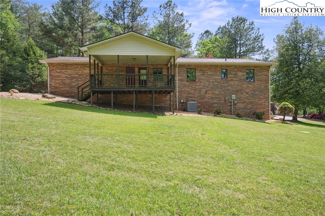 2076 Jay Clark Road Morganton, NC 28655 - Photo 3 of 36 a view of a house with backyard and garden