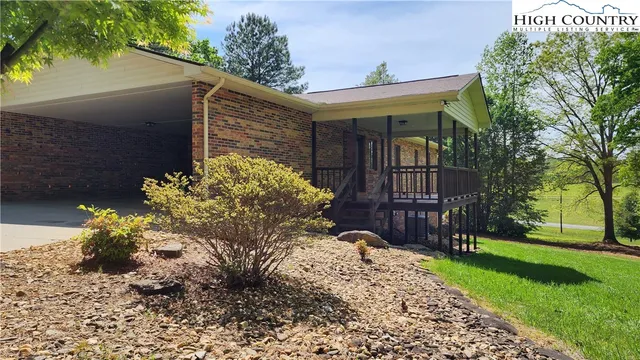 a view of a house with a yard and garage