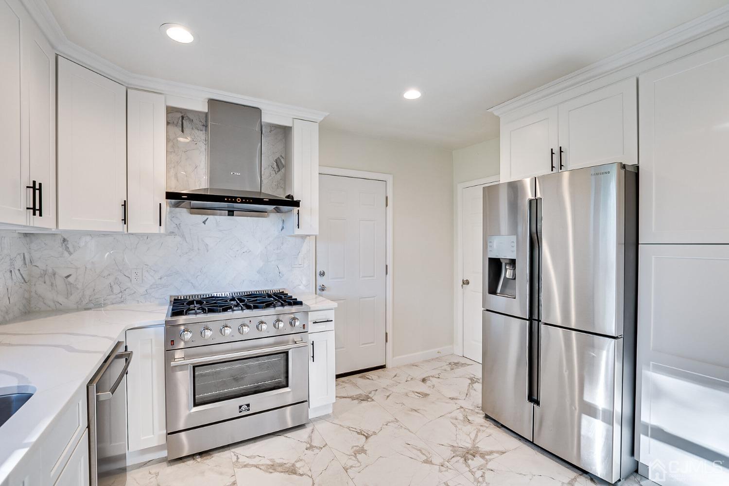 38 New Brooklyn Road Edison, NJ 08817 - Photo 21 of 39 a kitchen with a stove microwave and a refrigerator