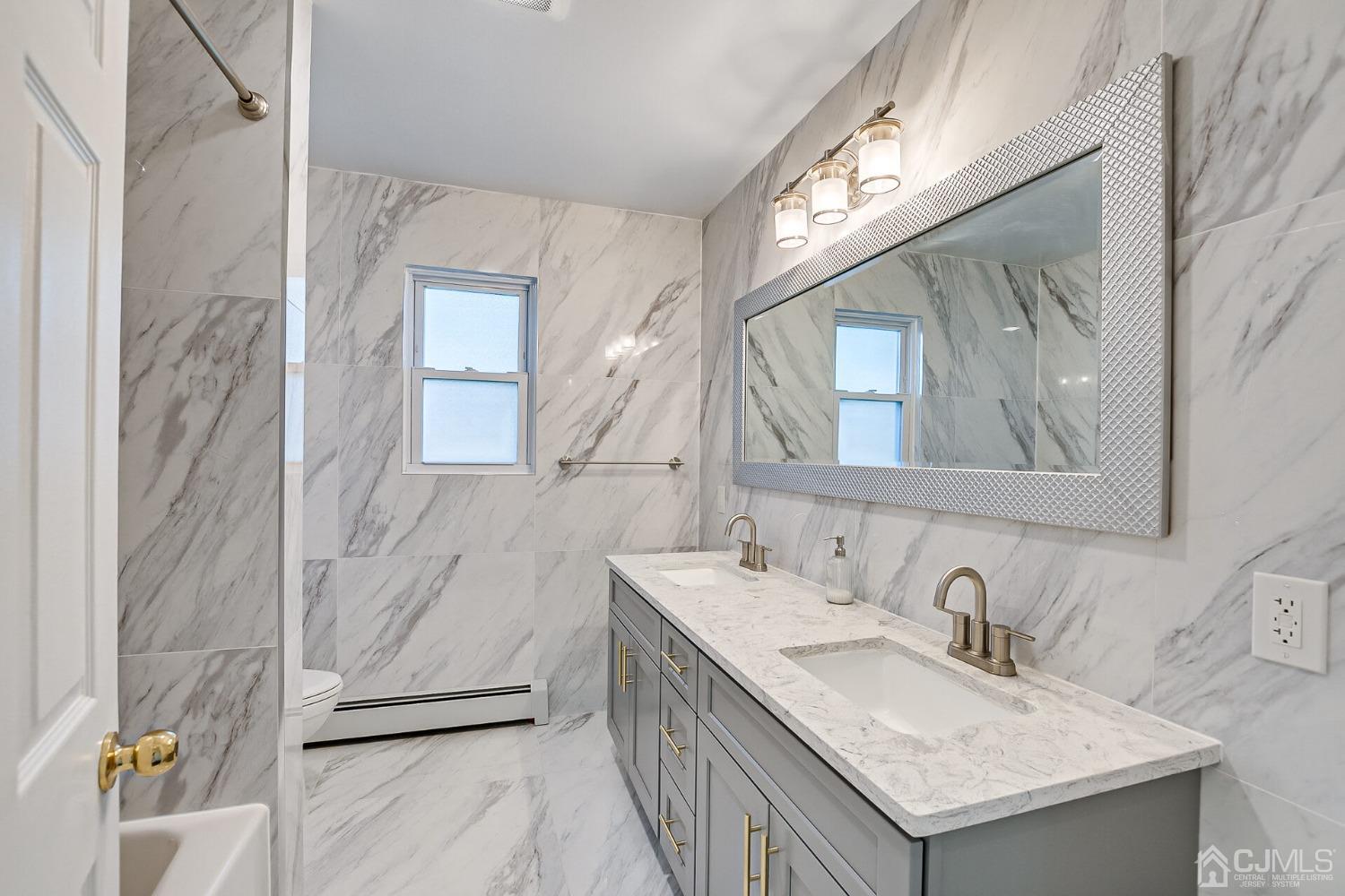 38 New Brooklyn Road Edison, NJ 08817 - Photo 30 of 39 a bathroom with a granite countertop sink and a mirror