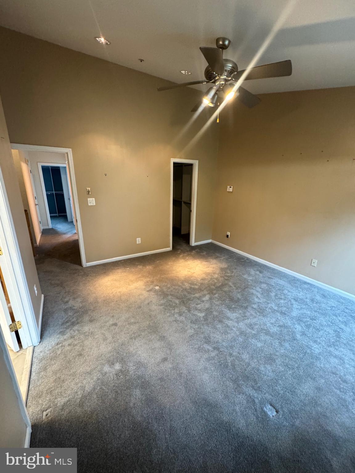 7705 Periwinkle Way, Unit 71 Severn, MD 21144 - Photo 17 of 28 en empty room with windows