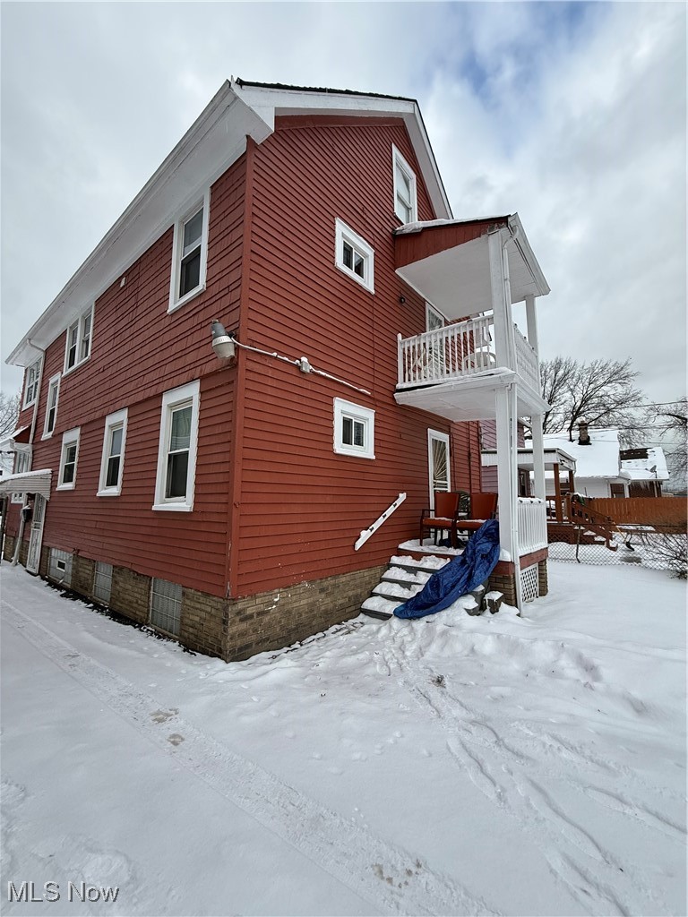 1667 Burgess Road Cleveland, OH 44112 - Photo 9 of 31 View of snowy exterior with a balcony