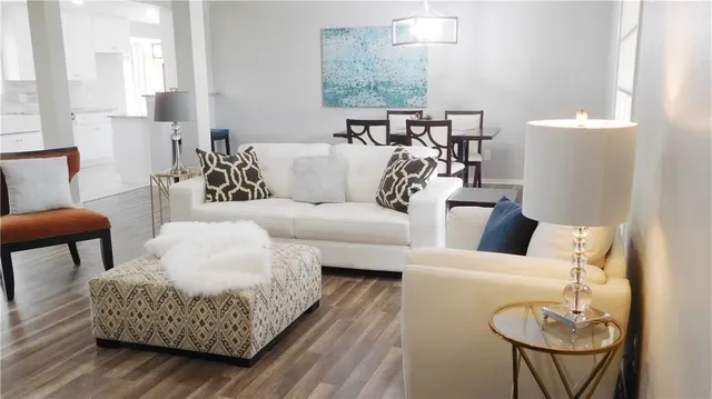 a living room with furniture and a table