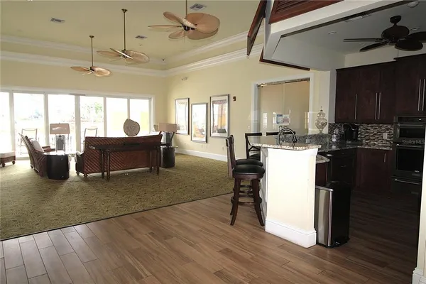 a view of a livingroom with furniture and staircase