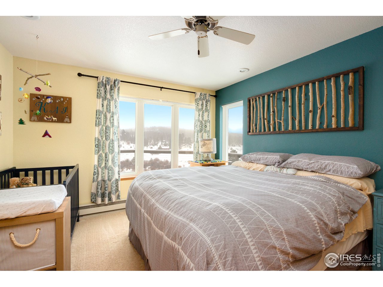 759 Huron Road Red Feather Lakes, CO 80545 - Photo 7 of 21 main floor bedroom