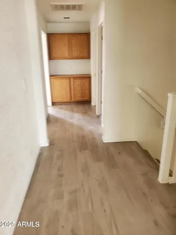 a view of an empty room with a bathroom