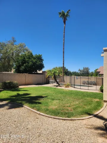 a view of a yard with a slide