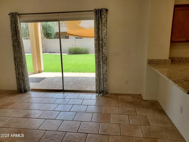 a view of a room that has a sink and a large window
