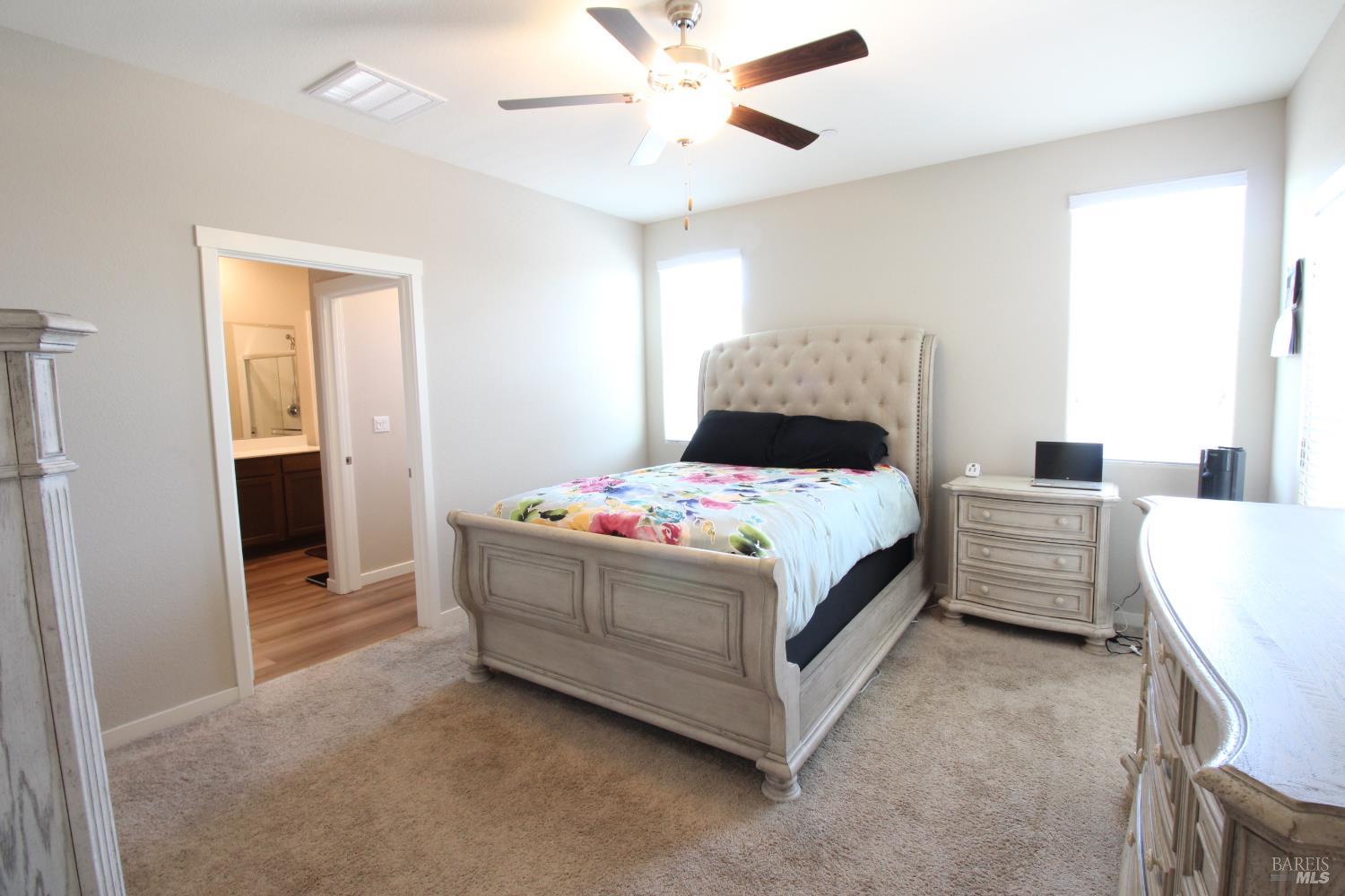 2283 Revival Lane Rio Vista, CA 94571 - Photo 11 of 44 a bedroom with a bed and a chandelier