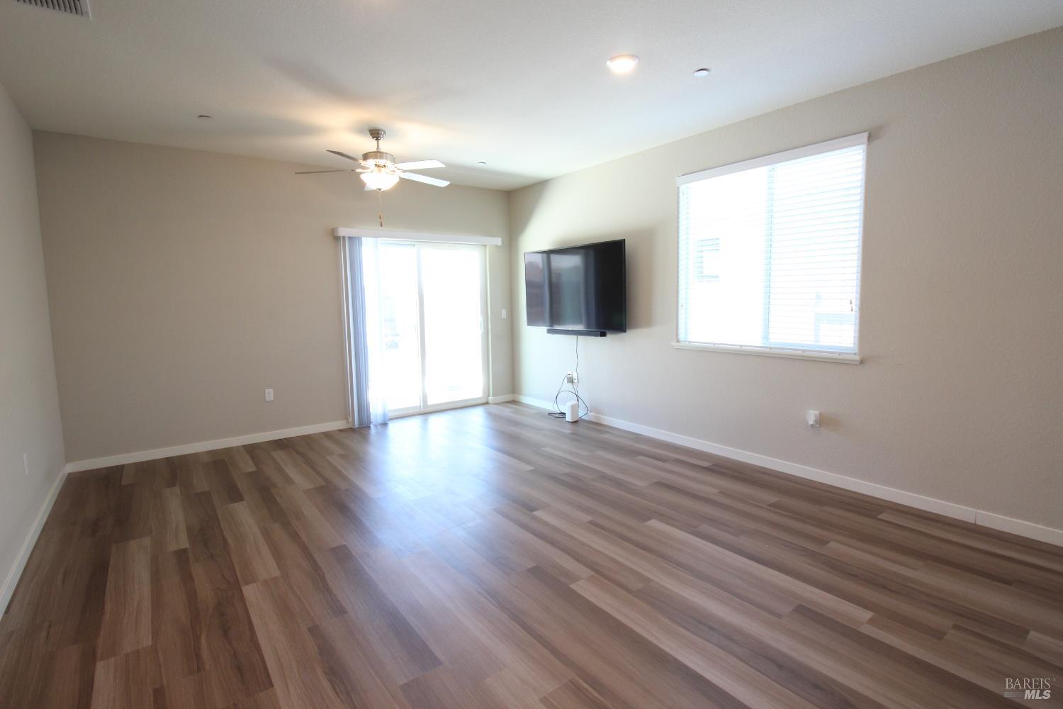 2283 Revival Lane Rio Vista, CA 94571 - Photo 16 of 44 a view of an empty room with wooden floor and a window