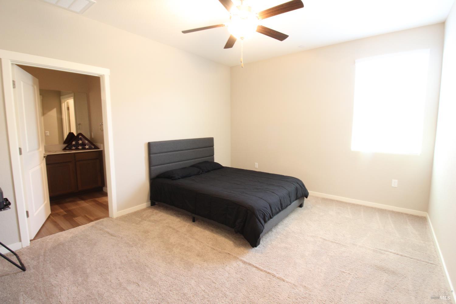 2283 Revival Lane Rio Vista, CA 94571 - Photo 18 of 44 a bedroom with a bed and cabinets