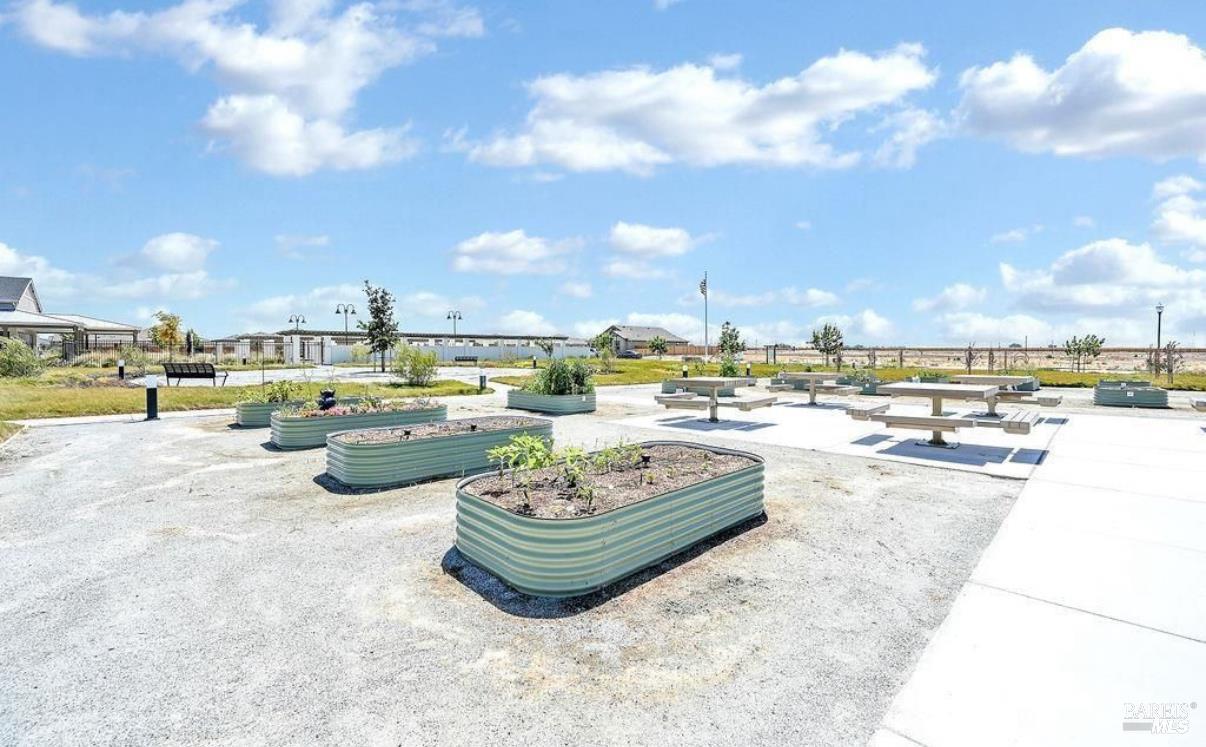 2283 Revival Lane Rio Vista, CA 94571 - Photo 42 of 44 a swimming pool with outdoor seating and a buildings in the background